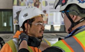 man putting on a hard hat