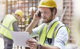 man in construction hat on the phone