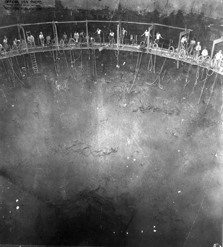 Miners inside one of the fuel tanks