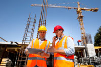 construction workers and a crane