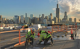 Workers from the Helm Group prepare roof openings