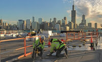 Workers from the Helm Group prepare roof openings