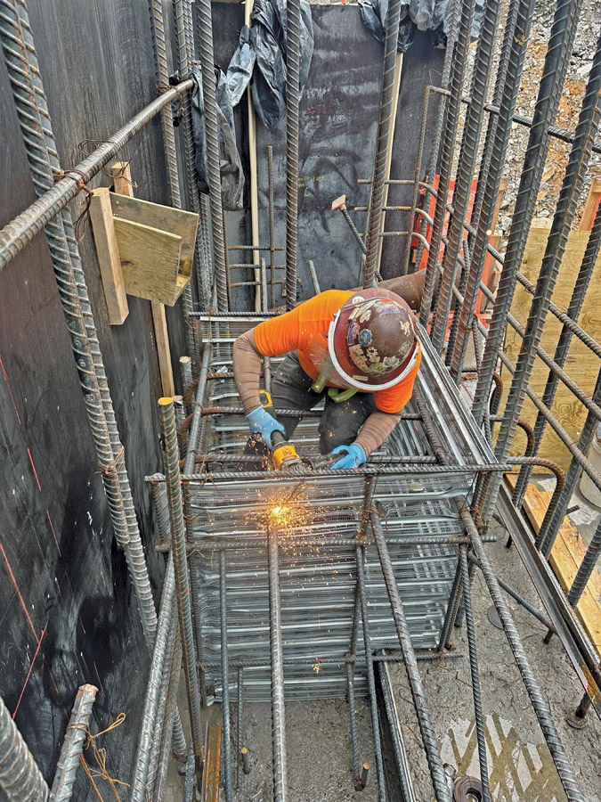 A carpenter installs a form of permanence