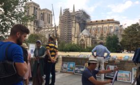 man watches notre-dame.jpg