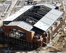 Colts stadium is first with panels sliding down pitched roof (left). Houston ballpark was first for Griffis-Silberman team.